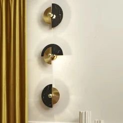 Applique Levante in ottone lucido e marmo Marquina