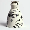 Candeliere in ceramica bianco e nero con 4 candele profumate