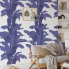 Carta da parati blu con foglie tropicali
