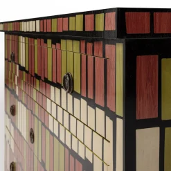 Cassettiera Gigi XVI a mosaico in legni misti di Ferruccio Laviani