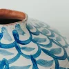 Cerchi blu e vaso azzurro