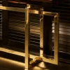 Console Charlotte con base in metallo placcato ottone