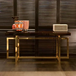 Console Charlotte con base in metallo placcato ottone