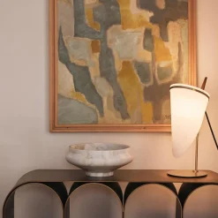 Console in acciaio con arco d'oro e bronzo