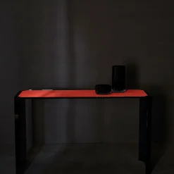 Consolle Jean Michel in vetro grigio fumé e pelle rossa