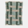 Coperta verde con frange e motivi intrecciati