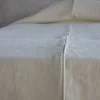 Copriletto in lino pesante crema con profili