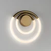 Lampada da parete Loop in metallo bronzo opaco