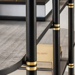 Libreria Boomerang in metallo nero e ottone con 4 ripiani di Pietro Russo Design