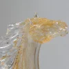 Piccolo cavallo seduto in vetro dorato