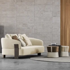 Pouf Iseo in tessuto marrone e pelle beige disegnato da Marco Piva