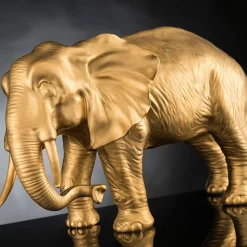 Scultura d'oro a forma di elefante del padre africano