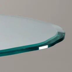 Tavolo Con Piano Rotondo In Vetro E Gambe Incorciate