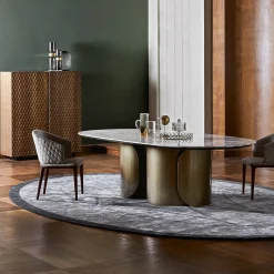 Tavolo da pranzo Oscar con base ovale in bronzo e top in marmo Calacatta Oro